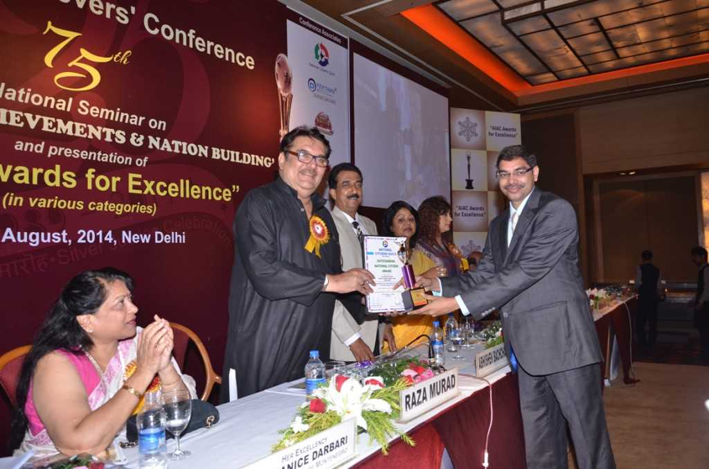 Dr. Narendra Kaushik receiving an Award of Excellence at the All India Achievers’ Conference