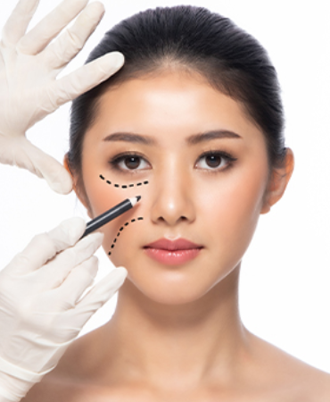 Illustrative photograph of a clinician assessing a facial treatment area